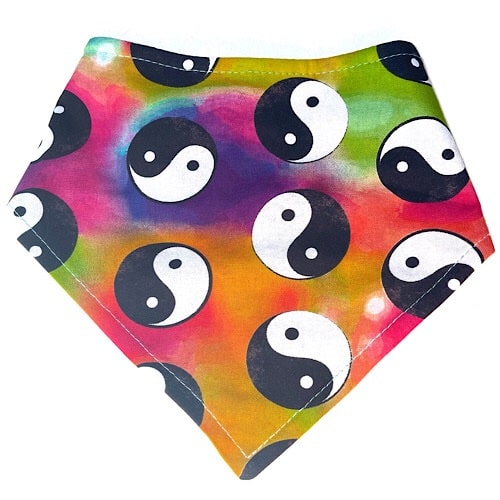 Handmade in the USA. Colorful tie dye dog bandana with black and white yin yang symbols. 3 snaps on back for an adjustable and secure fit.